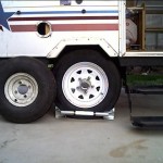 Finished. Old tire (left) as a comparison. BAL single wheel chock keeps trailer wheel secure.