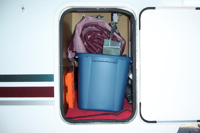 Everything we need to set up the camper is stored in this compartment with outside access.