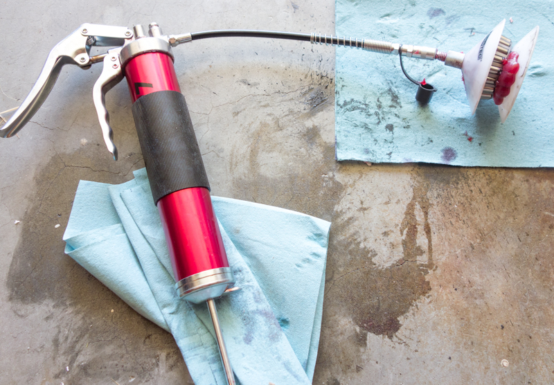 This simple bearing packer costs around $10 and grease is simply pumped in using a grease gun